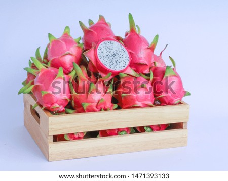 dragon fruit in basket on white background
