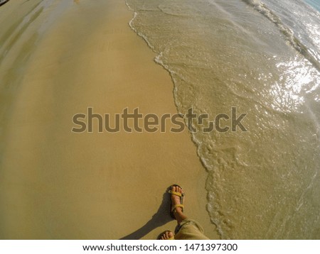 Walking in the beach between sand and sea,Andaman sea Thailand
