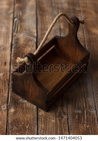 Empty wooden box on a wooden background.