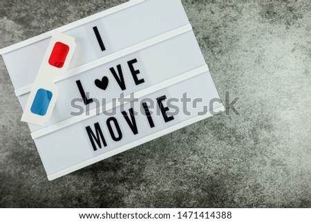 letter board with the word"I LOVE MOVIE" on vintage background. Flat lay.