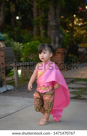 Cute girl wearing Thai dress