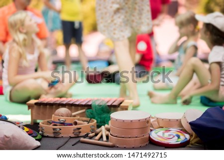 Musical instruments on the background of a group of children