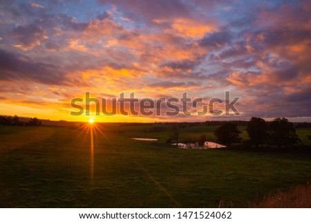 Beautiful sunset sky over farmland 