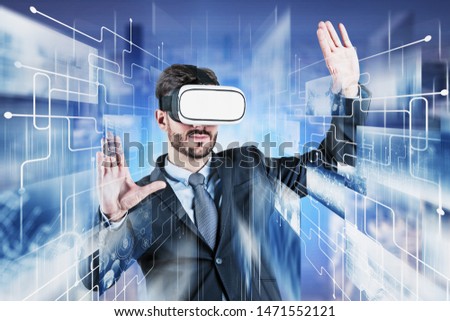 Young caucasian businessman in VR glasses working with social media and internet streaming service interface. Concept of hi tech. Toned image double exposure blurred