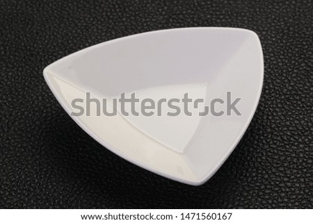 White porcelain bowl over black background