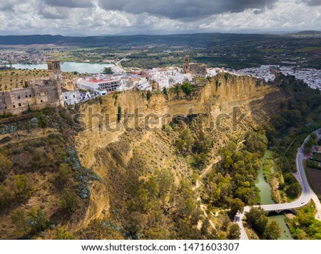 Picturesque cityscape of Arcos de la Frontera town on top sandstone ridge over Guadalete river, Spain