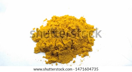 A picture of turmeric powder on a white background