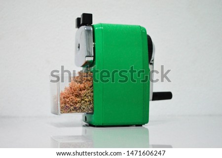 Green sharpener use to sharpen pencil to be sharp