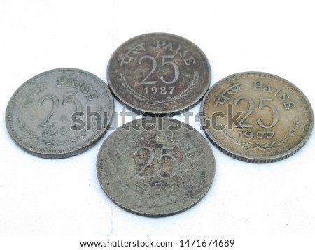 A picture of twenty-five paise coins on a white background