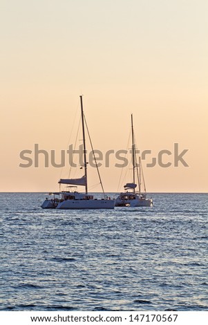 Boats In The Sea, Beautiful Sunset Light. High quality stock photo.