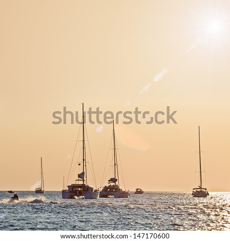 Boats In The Sea, Beautiful Sunset Light. High quality stock photo.