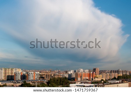 Giant cloud in the sky above the city