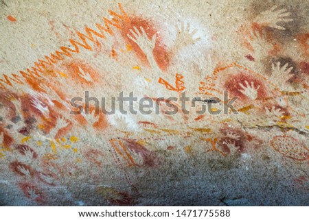 Cave paintings in Cave of hands or Cueva de las Manos in valley of Pinturas River. Patagonia, Argentina