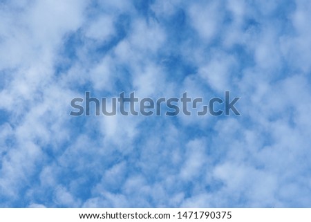 Cloudy blue sky abstract background in beautiful natural pattern. This natural artistic picture is usually captured in the rainy season before the storm. Sky in blue with white clouds. Blurry image