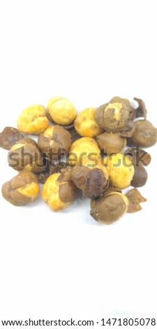 A portrait picture of salty chickpeas on white background