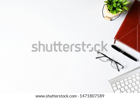 Working with keyboard computer and Notebook copy space on table background.Top view style.Minmal workspace,business Concept