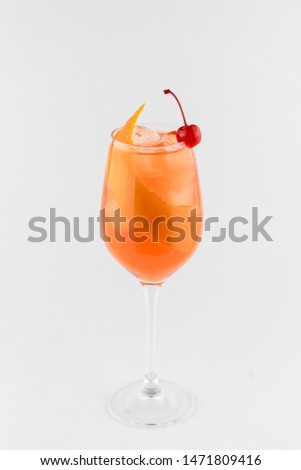Modern classic of alcoholic cocktails based on orange gin, bitter, prosecco, aperol spritz with orange peel for decoration isolated on white