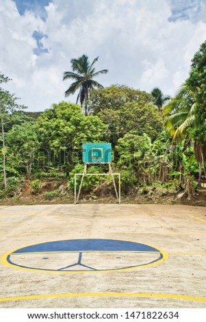Basketball Basket Blue Color On village Park With Trees and Basketball court.