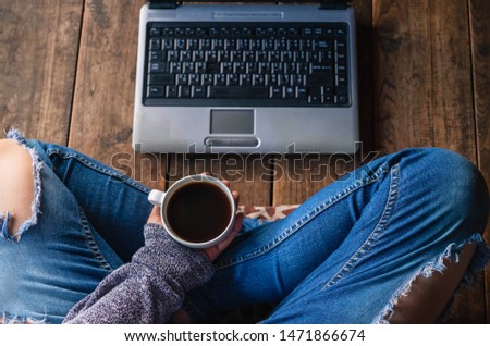 young business woman  sitting at  working online  and cup of coffee