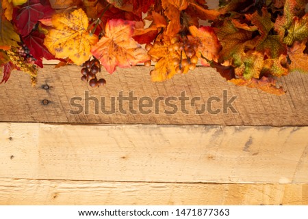 Autumn composition with dry leaves on a wooden table. View from above. Copy space. Autumn mood