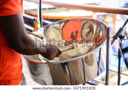 man is playing on a steel drums at cruise ship open deck Royalty-Free Stock Photo #1471901828