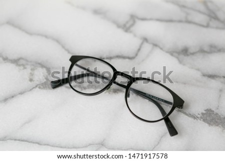 Black Glasses on Marble Background, Copy Text