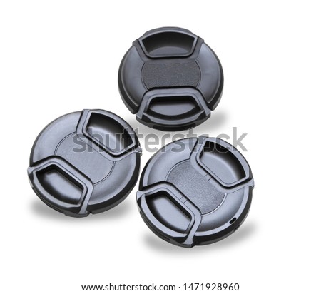 Three lens caps for digital camera isolated over white
