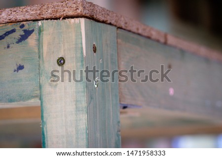 wooden construction with screwed metal angle bracket