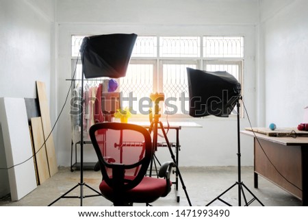 Photo Studio concept. There are equipment used to work. The softbox is a necessary device. As a light source, Beautiful place suitable for work. The camera is located and the props.