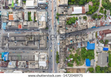 Above view, Traffic on the road with alley in old downtown at Kanchanaburi, Thailand