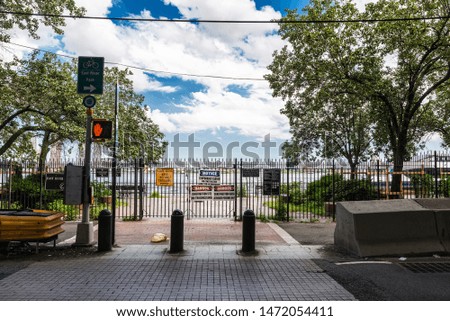 Signs of forbidden to pass, traffic and danger for construction works next to East River in Manhattan, New York City, USA