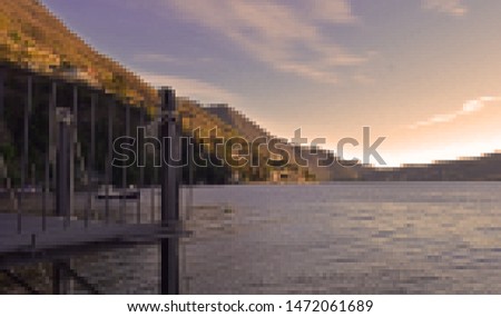 View of Lake and mountains in a pixelated artistic style. Lake como in italy sunset side view.