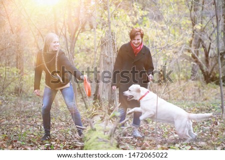 Young girl on a walk in the autumn garden
