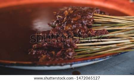 the process of making a typical satay lombok, Indonesia Royalty-Free Stock Photo #1472065127