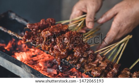 the process of making a typical satay lombok, Indonesia Royalty-Free Stock Photo #1472065193
