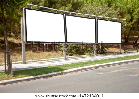 advertising board on asphalt road