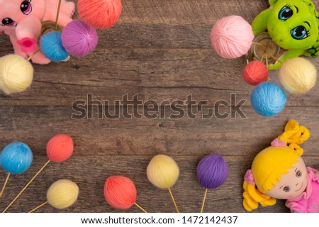 Plush baby toys and yarn balls, with copy space