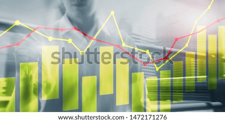 Yellow and red candles and charts on business technology background