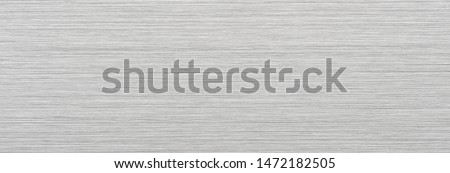 Evenly lighted Clean brushed metal texture. wide format. Royalty-Free Stock Photo #1472182505