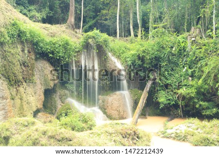 Beautiful waterfall in deep forest . Thansawan Waterfall  in  Doi Phu Nang National Park , Phayao provinces , Thailand