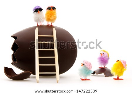 easter egg with toy chicks withe background
