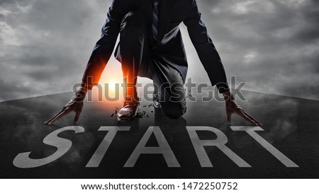 Businessman get ready on starting on the road.Start line on the highway concept for business planning. Royalty-Free Stock Photo #1472250752
