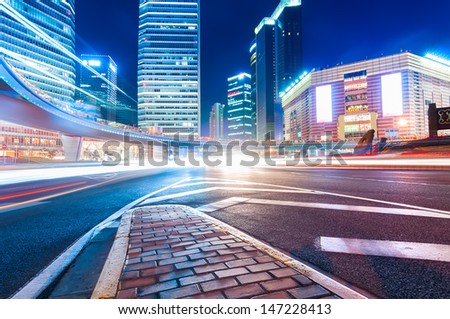 shanghai downtown at night with roundabout light trails