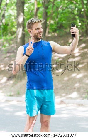 healthy life. athletic man in sportswear make selfie. outdoor workout. Fitness app. Ui ux concept. gadget in modern sport. muscular man in tracker. sport app on phone. digital sport. smart watch.