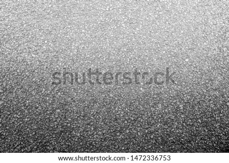 Gravel with small rocks floor texture background. Black and white gradient surface. Top view.