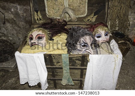 Terrifying theater masks in ancient trunk, interpretation and crafts