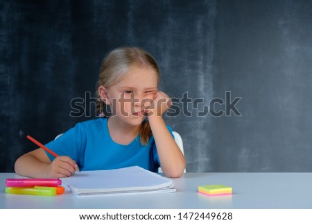 Dissatisfied little girl at school