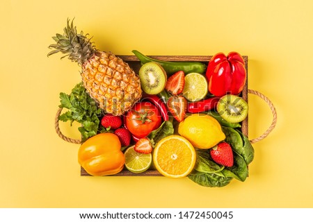 Fruits and vegetables rich in vitamin C in box. Healthy eating. Top view