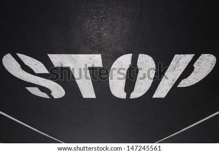 Stop sign painted on the road