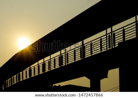 crossing silhouette of the bridge in the afternoon